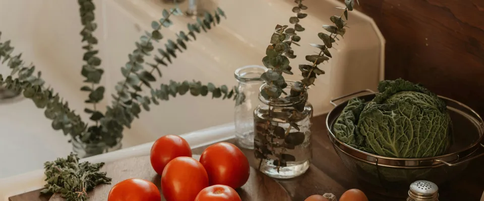 Fresh cooking ingredients on a kitchen counter in soft daylight